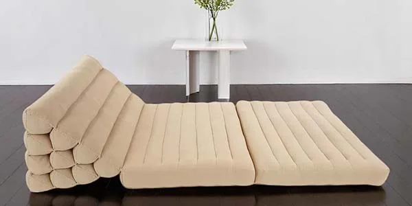 Triangle cushion with two foldable sections